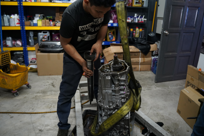 Mechanic repairing a gearbox